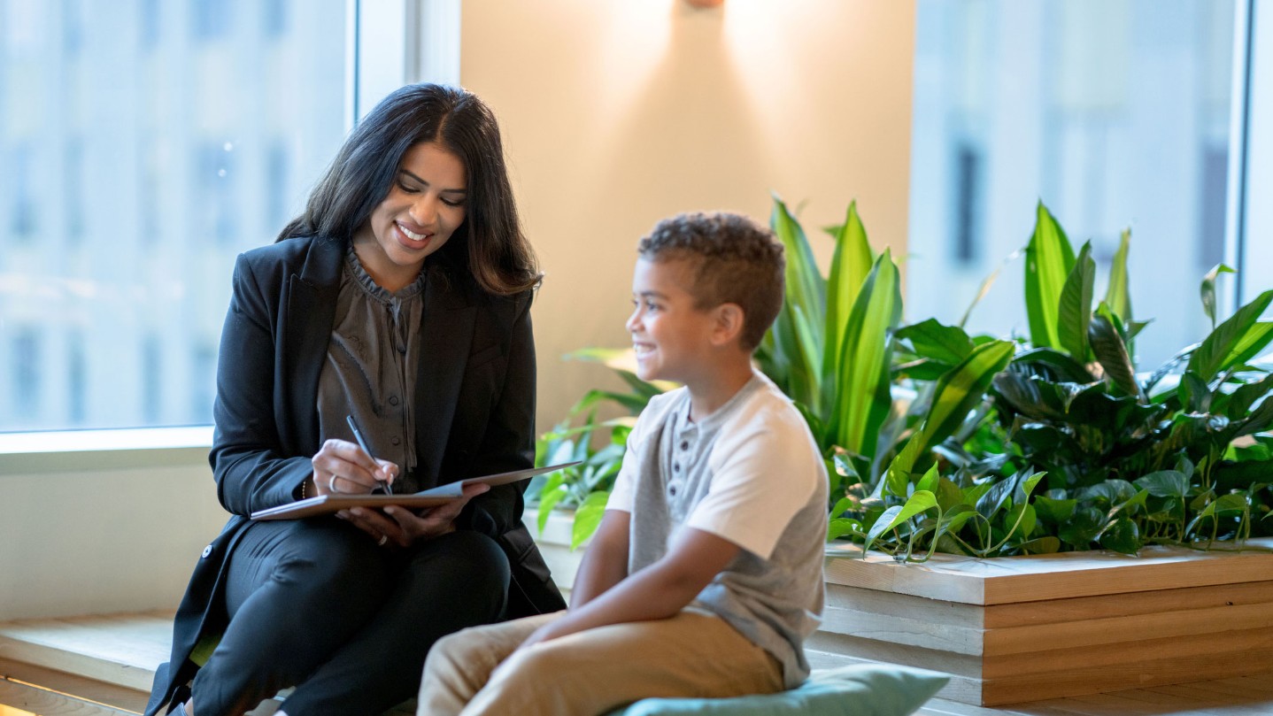 Child smiling to therapist