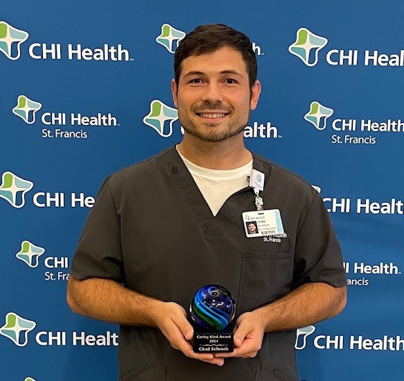 Schock receives CHI Health St. Francis Caring Kind Award Photo of Chad Schock with Caring Kind Award