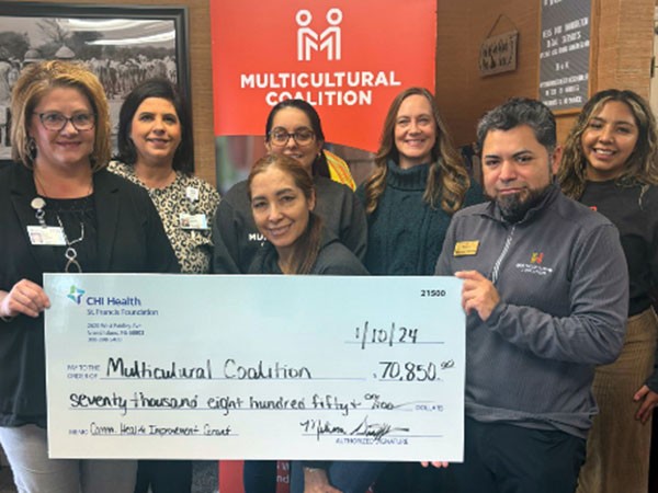 Group of people accepting check
