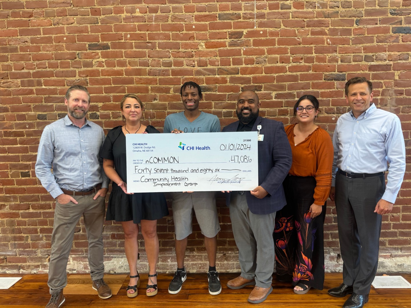 CHI Health Gives $450K in Community Improvement Grants Group photo of check presentation to In Common