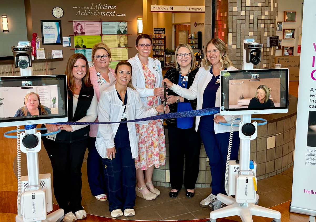 St. Francis team standing at a ribbon cutting for the Virtually Integrated Care program.