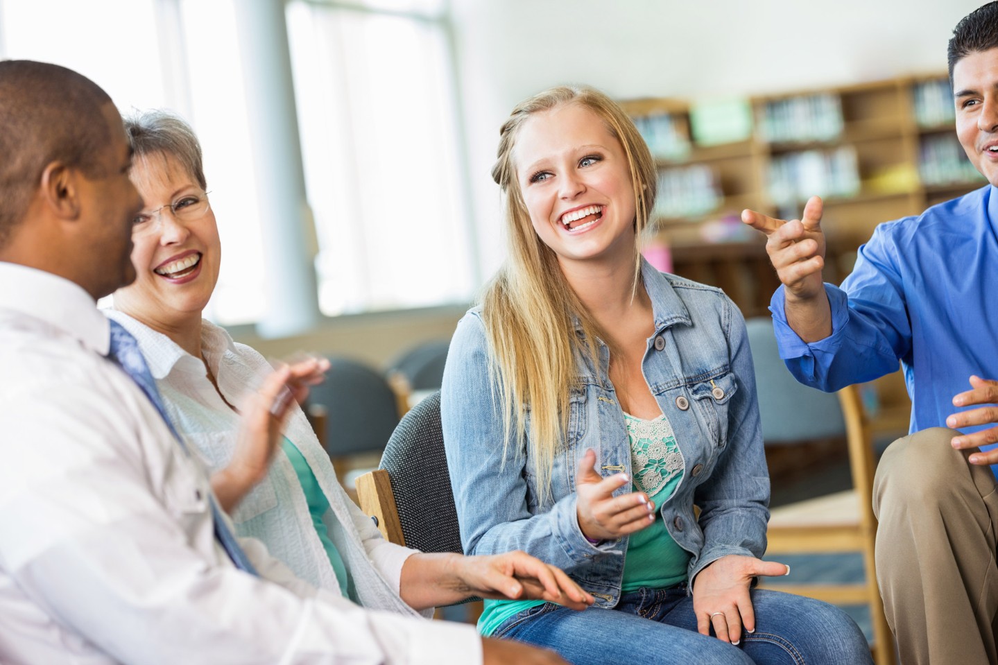 happy people in a group class sitting