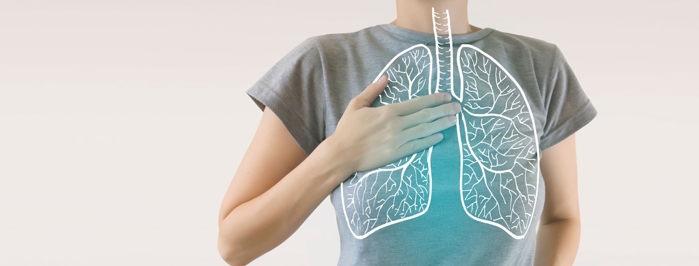Woman holding chest, illustration of lungs overlay