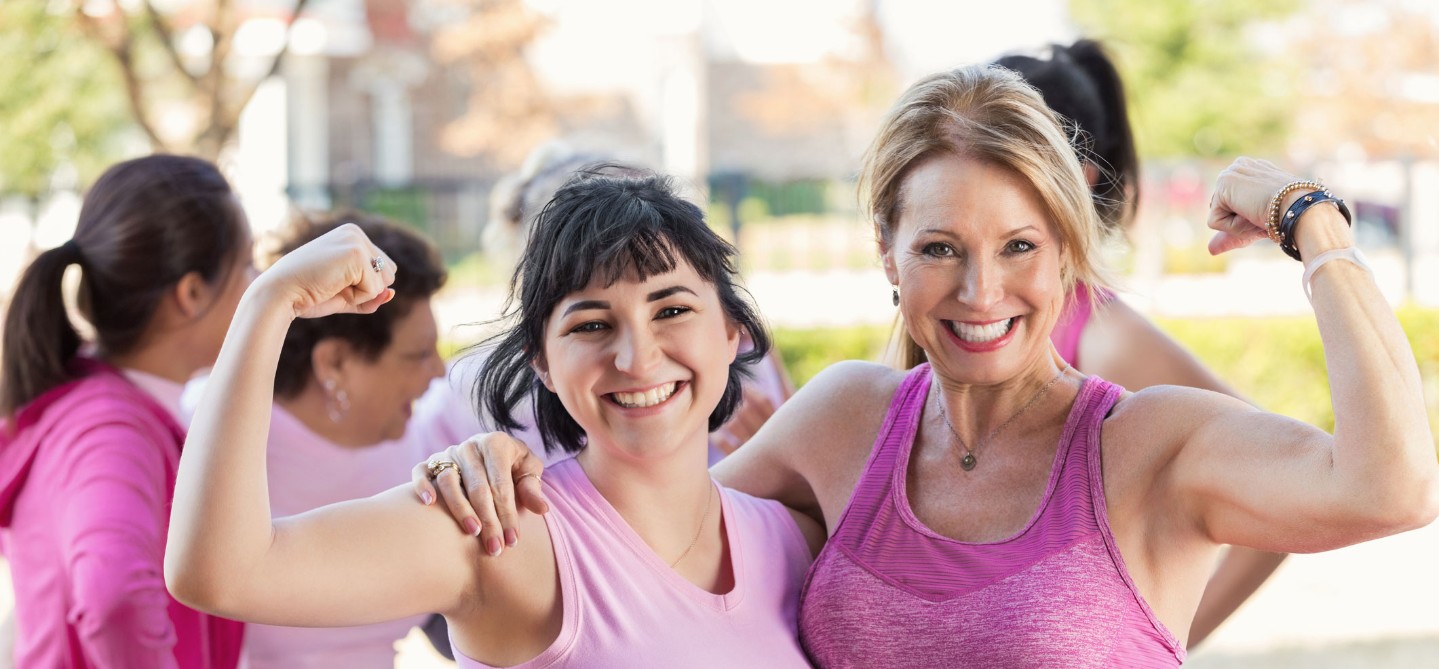 Group of women in pink shirts