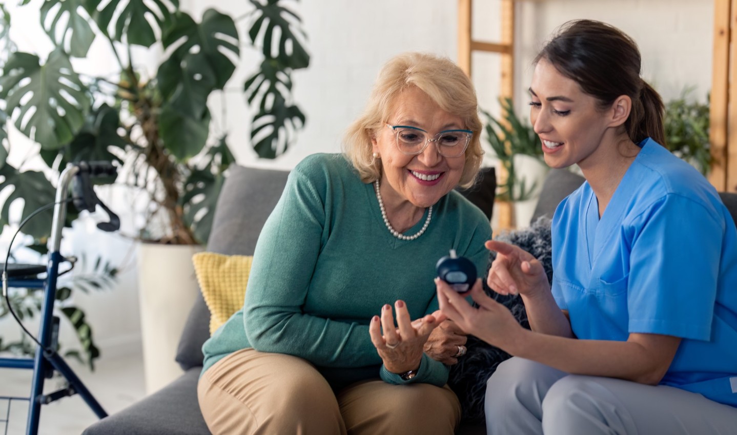 Diabetes educator working with an elderly patient