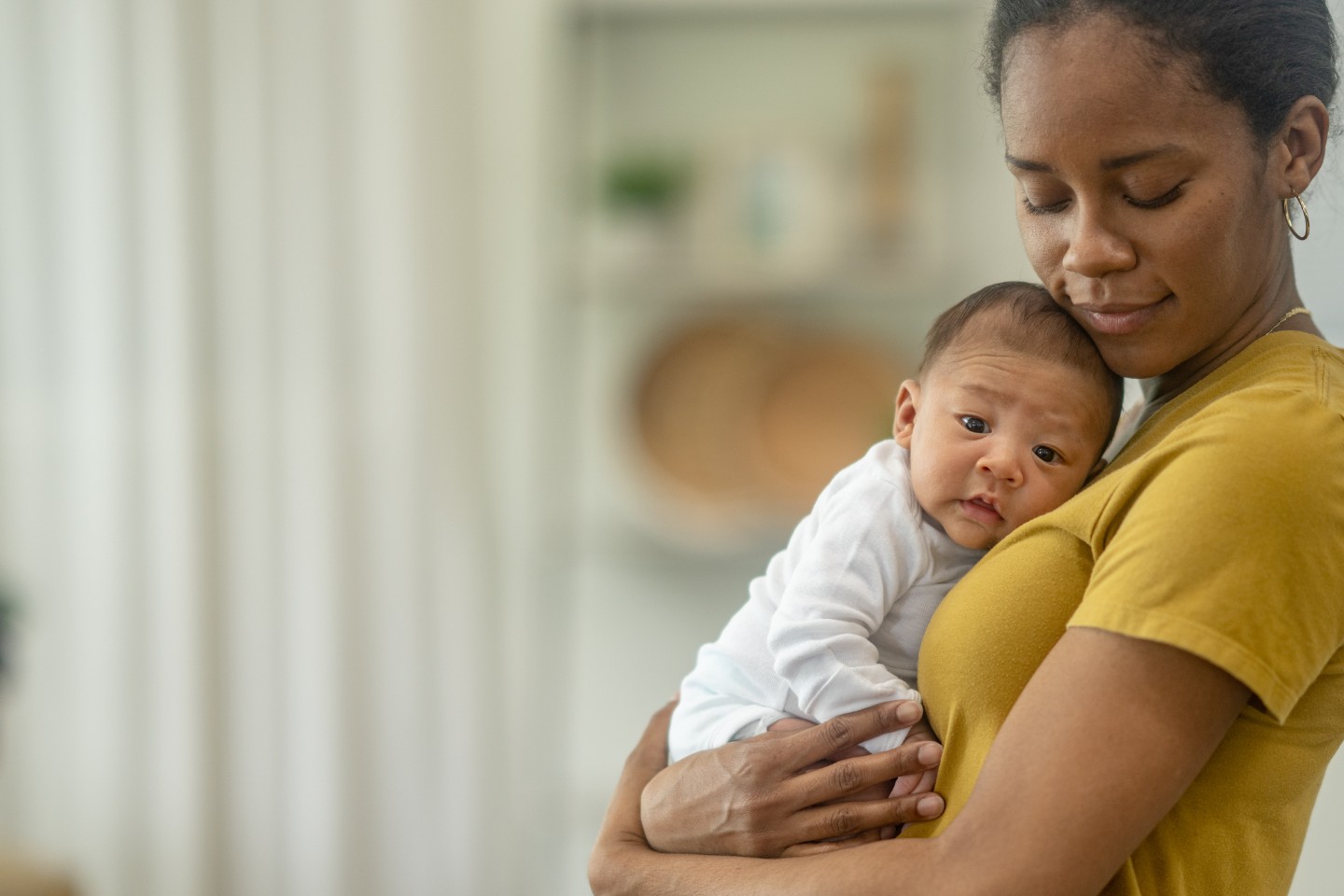 Mom holding a cute newborn baby