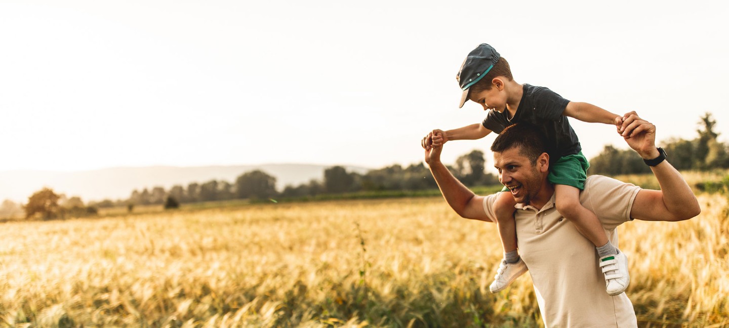 Man with child on shoulders