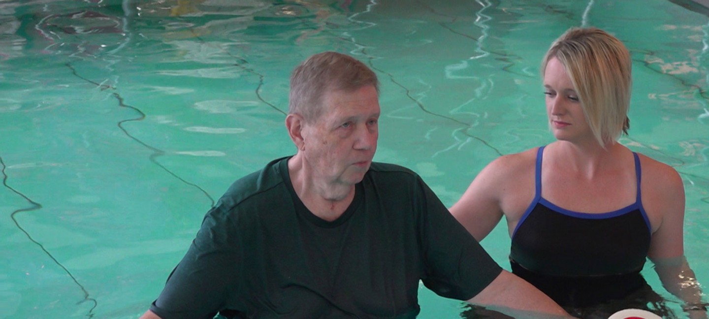 Therpist and man in pool 