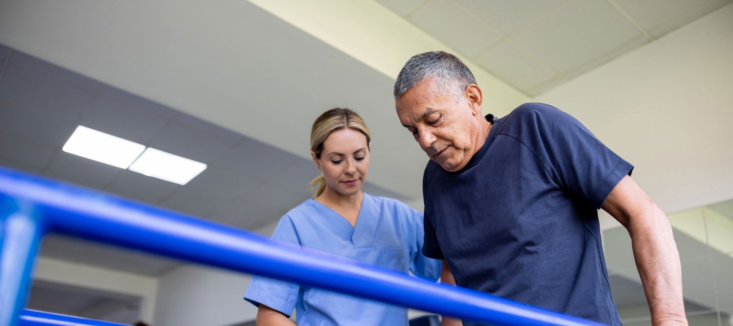 Man walking at physical therapy