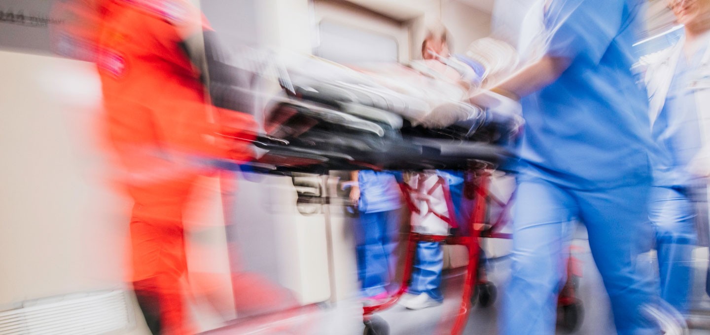 Blurred image of emergency responders and nurses